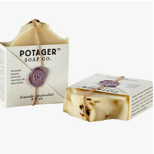 Potager Soap Co. handmade soap in the French Lavender scent. Label is held onto soap with a piece of twine and a melted wax seal. Two bars shown, one standing and one laying on its side.