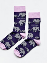 Load image into Gallery viewer, Dark purple socks with light lavender cuffs, heels and toes. Grey elephants with white tusks line the socks. The name Bare Kind is written in light grey under the first row of elephants.