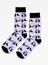 Load image into Gallery viewer, Light lavender socks with black cuffs, heels and toes. Black and white pandas line the socks. The name Bare Kind is written in grey under the first row of pandas. 
