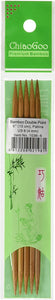 Five light brown double pointed bamboo needles in light green plastic packaging; Top of packaging reads "ChiaoGoo, Premium Bambo"; Price sticker on middle of packaging with barcode and size of needles listed; Image of woman kneeling and knitted pictured at bottom of packaging 