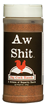 Black bottle label, white lettering, white cap and red chicken logo. Seasoning name; "Aw shit" 