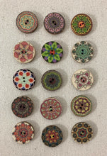 Load image into Gallery viewer, Image of several round and colorful buttons on tan background. Each has two holes in middle and mandala pattern around 
