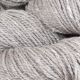 Close up image of Driftwood colored yarn hank; Light gray and white in hue