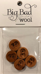 Image of 5 round wooden buttons in small plastic package that reads "Big Bad Wool" in black at top label. Each button has two holes in middle with two round indentions around holes