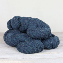 Load image into Gallery viewer, 3 skeins of dark blue/green yarns with flecks of white and purple throughout on white background.