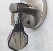 Load image into Gallery viewer, Small black mesh bag reads &quot;Conditioner&quot; on small pink label and contains white bar of conditioner soap as it hangs on shower handle