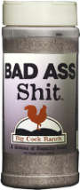 White and silver bottle label, black lettering, white cap and red chicken logo. Seasoning name; "Bad ass shit"