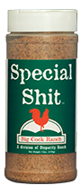 Green bottle label, white lettering, white cap and red chicken logo. Seasoning name; "Special shit"