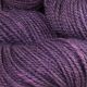 Close up of Thistle colored yarn hank; Bright deep purple hue