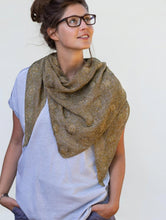 Load image into Gallery viewer, Woman in white shirt and brown knitted scarf looks off to the side on a white background
