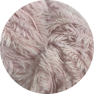 Close up of light pink feathery wool yarn