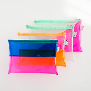 Several colorful pouches all in a line made up of bright pinks, oranges, blues, yellows, and greens