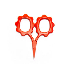Load image into Gallery viewer, Red scissors with decorative handles on a white background