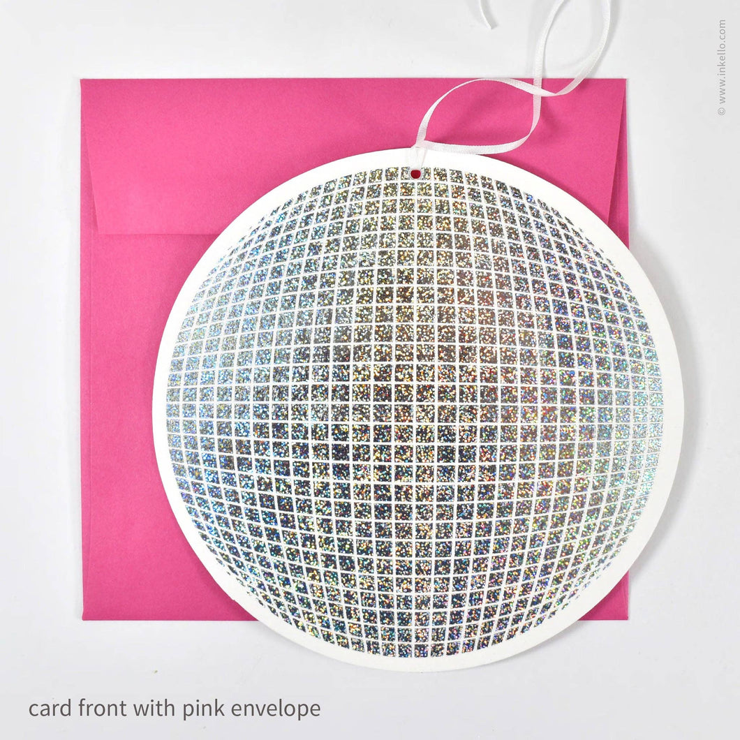 Decorative card front with rhinestone pattern on a pink envelope