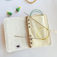 Load image into Gallery viewer, Knitting needle case with knitting needles and yarn on a white background