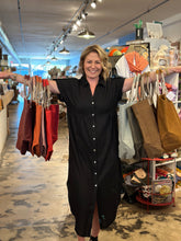 Load image into Gallery viewer, Blonde woman in long black dress with arms out and tote bags hanging from her arms.