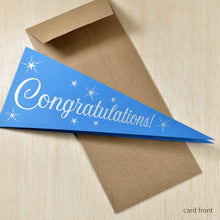 Load image into Gallery viewer, Blue pennant-shaped card with &#39;Congratulations!&#39; text on a brown envelope.