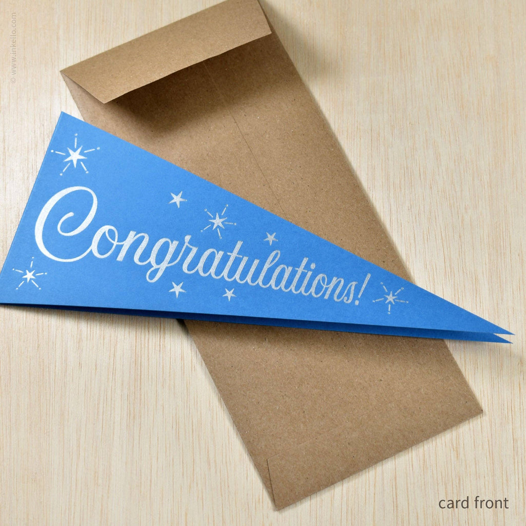 Blue pennant-shaped card with 'Congratulations!' text on a brown envelope.