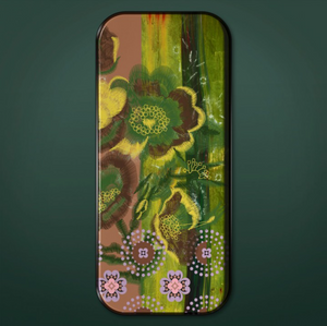 Long colorful tray on green background. Images of flowers on tray in shades of green, yellow, brown, pink, and purple.