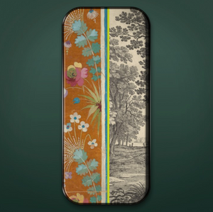 Long colorful tray on green background. Tray features images of flowers and trees in shades of orange, green, blue, pink, and gray