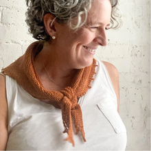 Load image into Gallery viewer, Image of a woman smiling and wearing a small russet colored knitted bandana