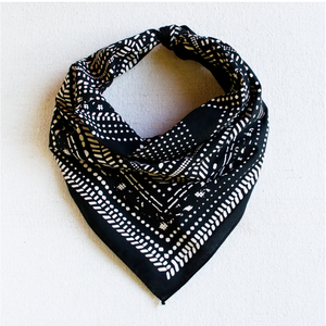 Black bandana with white lines, dots, and grid designs