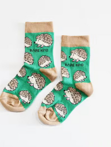 Green socks with tan cuffs, heels and toes. Tan and beige hedgehogs line the socks. The name Bare Kind is written in black under the first row of hedgehogs.
