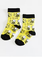 Load image into Gallery viewer, Yellow socks with black cuffs, heels and toes. Yellow and black bees with white wings line the socks. The name Bare Kind is written in black under the first row of bees.