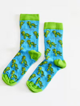 Load image into Gallery viewer, Aqua blue socks with lime green cuffs, heels and toes. Lime green turtles line the socks. The name Bare Kind is written in grey under the first row of turtles.