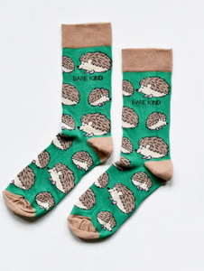 Green socks with tan cuffs, heels and toes. Tan and beige hedgehogs line the socks. The name Bare Kind is written in black under the first row of hedgehogs.