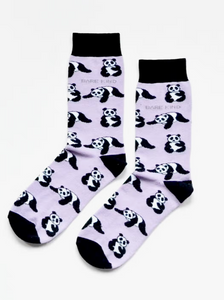 Light lavender socks with black cuffs, heels and toes. Black and white pandas line the socks. The name Bare Kind is written in grey under the first row of pandas. 