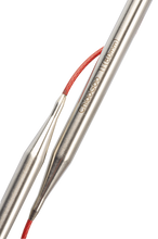 Load image into Gallery viewer, Close up of connection between stainless steel needles and red cables on circular knitting needles; Needles read &quot;ChiaoGoo 11(8.0mm) in light bronze