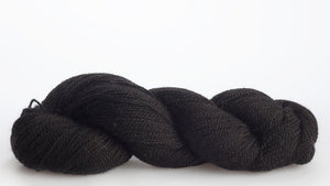 Isager Alpaca 2 yarn in color 30 laid out on white background. Color 30 is mostly black and shades of dark gray