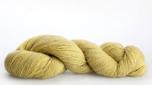 Isager Alpaca 2 yarn in color 35 on white background. Color 35 mostly shades of light yellow and green