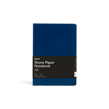 Load image into Gallery viewer, Soft dark blue journal; Large black rectangular paper wrap half way down reads &quot;KARST&quot; &quot;Stone paper Notebook &quot;A5&quot; on right side; Small &quot;K&quot; in right side bottom corner of cover