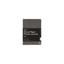 Load image into Gallery viewer, Small dark gray journal on white background with black paper wrap covering middle section; Black wrap reads &quot;KARST&quot; &quot;Stone Paper Pocket Journal&quot; &quot;A6&quot; in white on right side; Small white &quot;K&quot; stamped in bottom right corner of cover