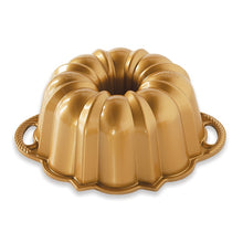 Load image into Gallery viewer, Bright gold bundt pan with 2 rope patterned handles on white background; fluted edges with rounded and pointed designs