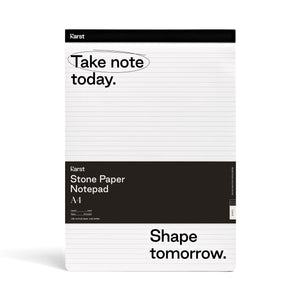 Image of white and black notepad on white background; Thin black line runs across top of notepad with "KARST" printed on top right corner; Below, on white background with black lines running across, reads "Take note today." with a black circle around "Take note"; Large black rectangle runs across pad half way down and reads "KARST" "Stone Paper Notepad" "A4"; Bottom section of pad is white with black lines and in bottom corner, in black, reads "Shape tomorrow."