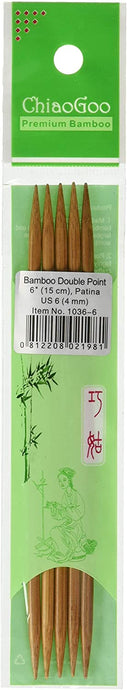 Five light brown double pointed bamboo needles in light green plastic packaging; Top of packaging reads 