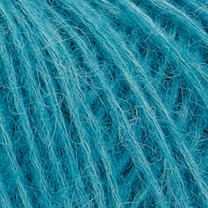 Close up of Rowan Alpaca Classic in color 107. Strands in shades of light and medium blue