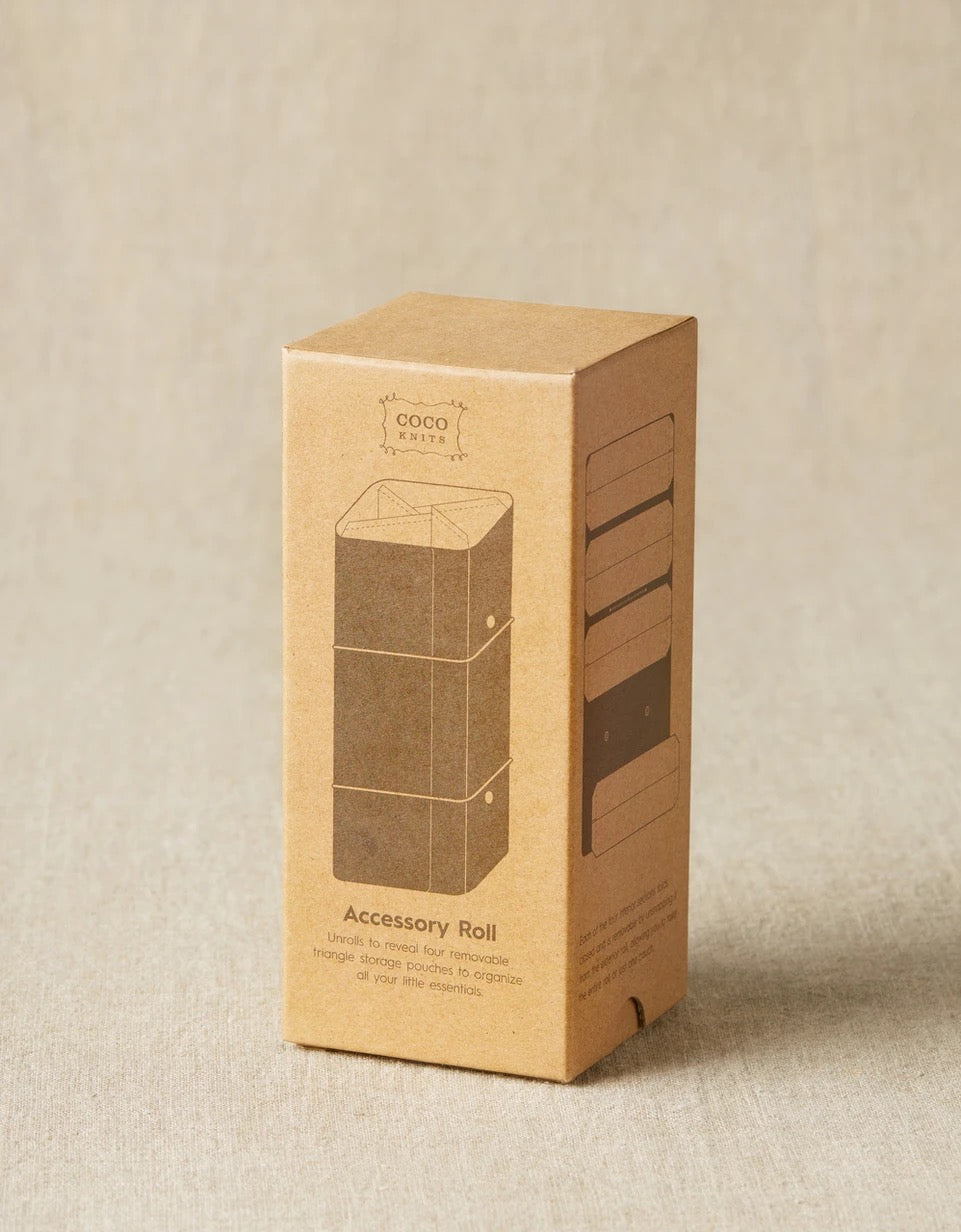 Image of small cardboard box container on light tan background; Box angled to side to show front and right of box; Front of box reads 