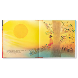 Opened pages of book All That I Am. Left side shows bright yellow sun hanging in the sky above the books' text. Right side shows young boy and various woodland birds and animals all crowded onto tall tree and staring up at the sun