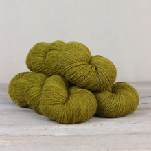 Load image into Gallery viewer, The Fibre Co. Amble yarn in color Buttermere. Strands in shades of green and yellow