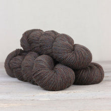 Load image into Gallery viewer, The Fibre Co. Amble yarn in color Fair Hill. Strands in shades of blue, gray, orange, and brown