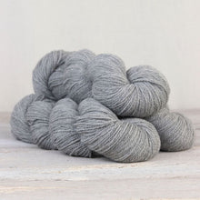 Load image into Gallery viewer, The Fibre Co. Amble yarn in color Isel. Strands in shades of light gray