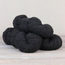 Load image into Gallery viewer, The Fibre Co. Amble yarn in color Saddleback Slate. Strands in shades of dark gray