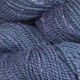 Close up of Blueberry colored yarn hank; Deep blue hue with white speckles throughout