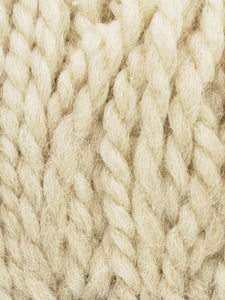 Close up of Jody Long Andeamo yarn in color 004. Strands in shades of light white and cream