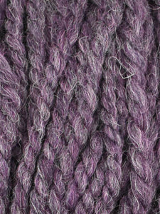 Close up of Jody Long Andeamo yarn in color 020. Strands in shades of light gray and purple