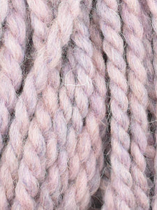 Close up of Jody Long Andeamo yarn in color 024. Strands in shades of light pink and light purple